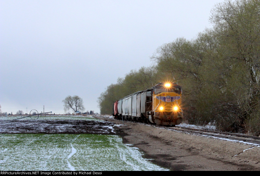 UP SD70M #4367 leads the northbound Cache Valley Local (LCG-41C) approaching the E. 7800 N. xing in Smithfield, Utah April 13, 2022